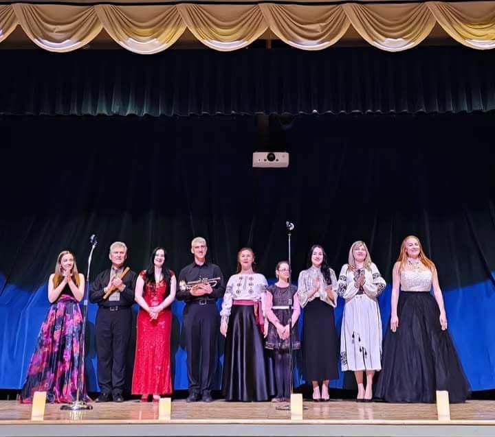 Ensemble taking a bow on stage